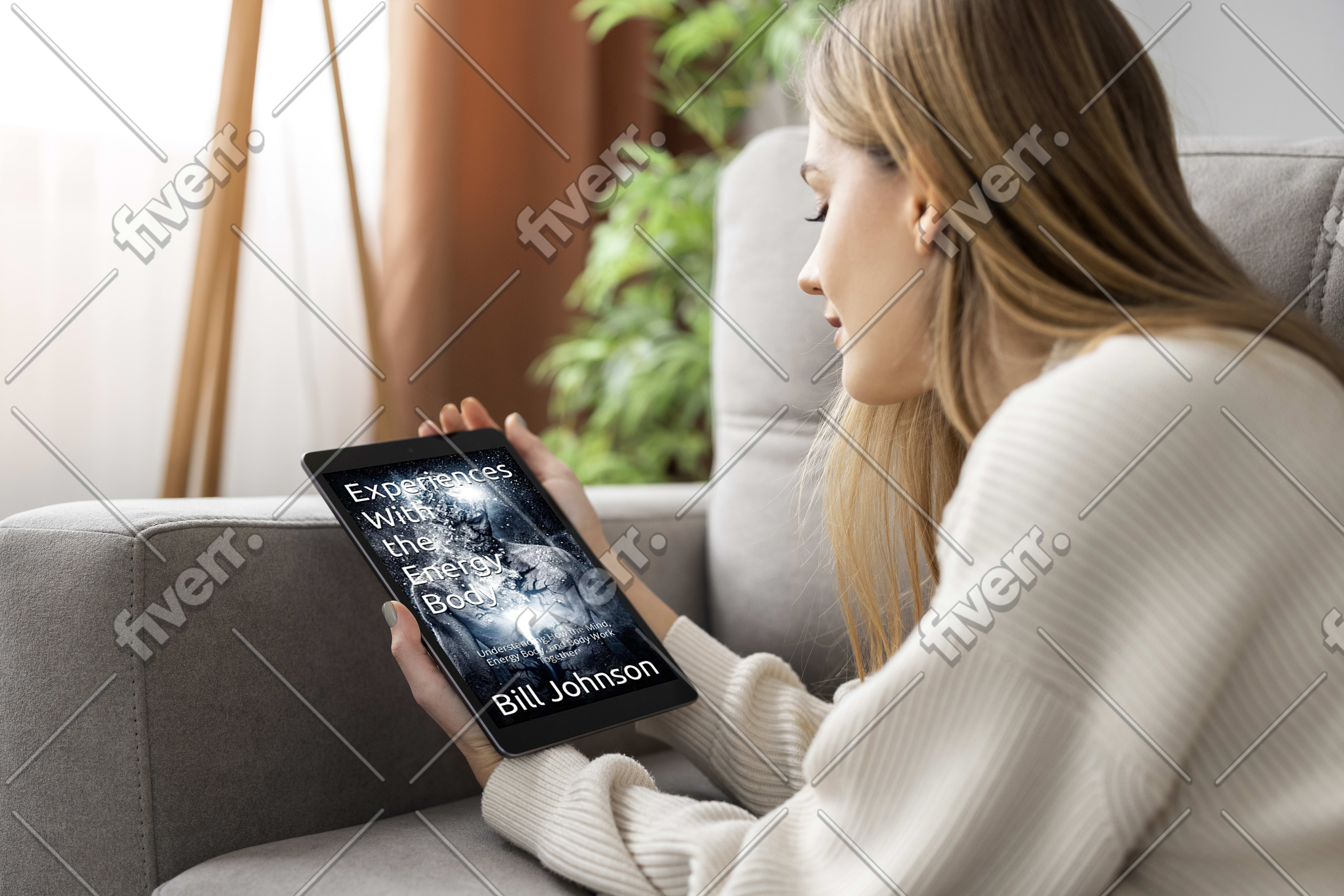 woman looking at cover of Experiences With the Energy Body